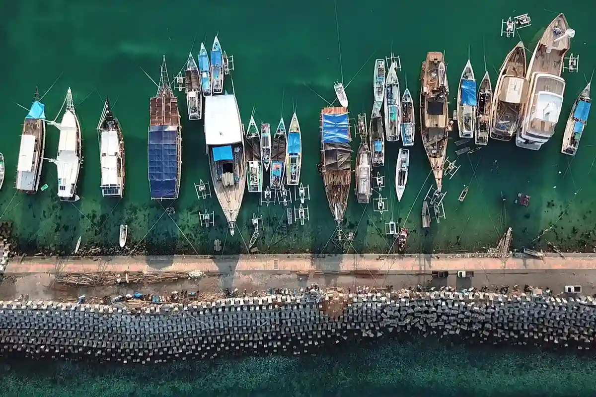 Boats moored in Labuan Bajo harbour from above