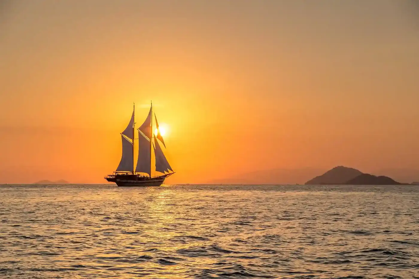 Phinisi sailing into the sunset