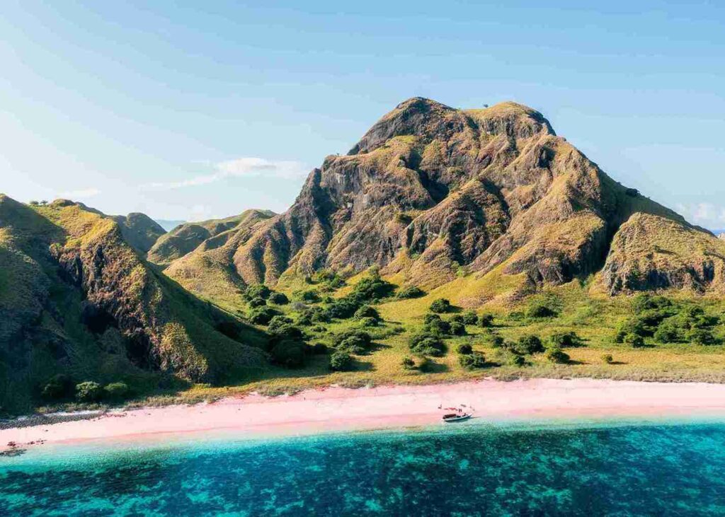 Drone view of Pink Beach and the surrounding hills in Komodo