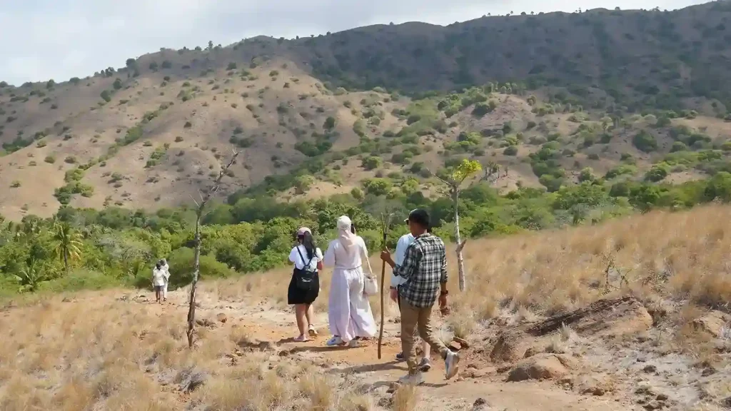 Ranger guiding visitors on a trekking trail on Rinca Island