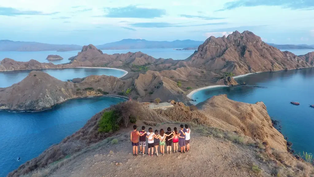 Visitors posing at the Padar Island summit viewpoint