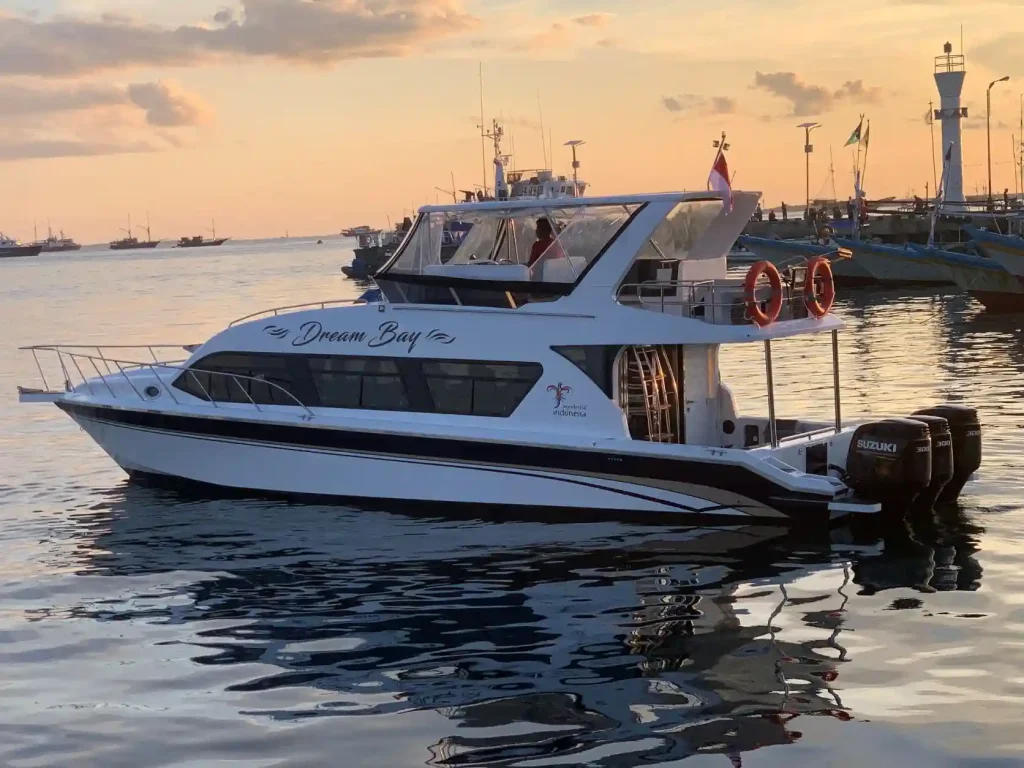 Speedboat moored at a harbour pier at sunset